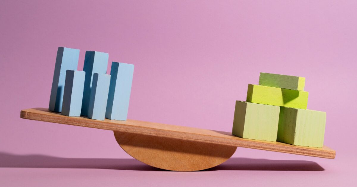 A seesaw balancing blue blocks and green blocks