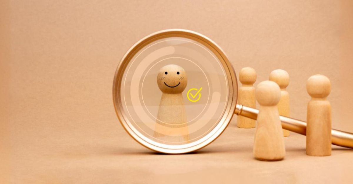 Magnifier glass over a wooden pawn with vector tick emoji